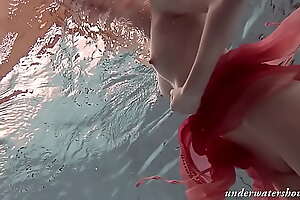 Katya Okuneva strips in her red lingerie underwater