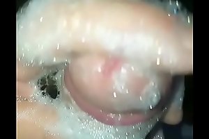 Slow mo washing cock in shower