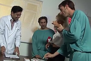 Cum-hungry Kathy gets three doctors in her mouth on the couch.